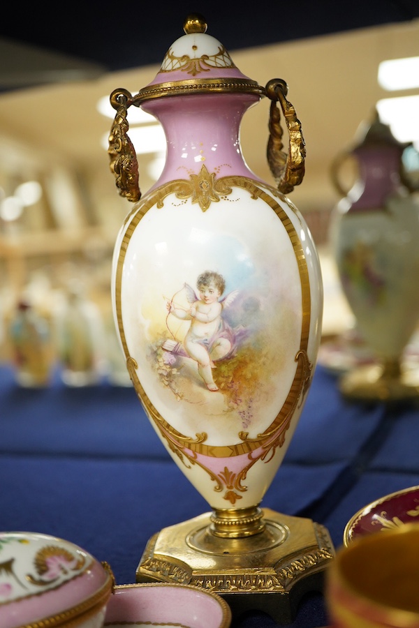 A collection of porcelain to include a Vienna cabinet cup and saucer, continental ormolu mounted urn, Limoges Bonbonniere and stand etc. tallest 20cm